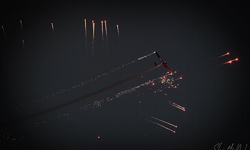 airborne pyrotechnic in the evening sky