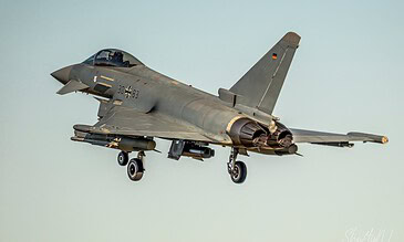 Stunning military aircraft photography showcasing the Euro fighter jet in flight with detailed features and sleek design. Euro fighter jet soaring through the sky during a military aircraft display.