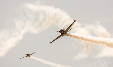 Father and son: the real SF.260 and its RC twin. SIAI-Marchetti SF.260 D-EDUR flying in formation with an exact radio-controlled scale replica flown by the pilot's son at the Leaseweb Texel Airshow, Texel International Airport, the Netherlands, August 2018.