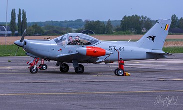 Grey Wolf ST-41 ready to go. Grey Belgian SIAI-Marchetti SF.260 ST-41 with wolf tail art and two pilots in the cockpit at Beauvechain Air Base, Belgium, April 2018.