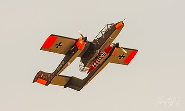 OV-10 Bronco with poppy artwork. North American OV-10 Bronco 99+18 in German markings with poppy artwork climbing away at the Leaseweb Texel Airshow, Texel International Airport, the Netherlands, August 2018.