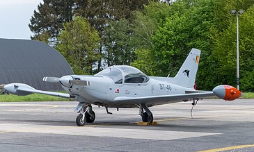 ST-46 at rest. Grey SIAI-Marchetti SF.260 ST-46 parked on the platform with chocks at Beauvechain Air Base, Belgium, April 2018.