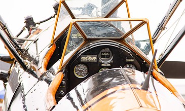 Stearman cockpit details. Close-up of the cockpit of Boeing Stearman N9912H with its instruments and windscreens at the Leaseweb Texel Airshow, Texel International Airport, the Netherlands, August 2018.