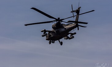 AH-64D Apache of 301 Squadron "Redskins", Royal Netherlands Air Force, banking towards the camera at the Bergen (Osterheide) shooting range, Germany, March 2017.