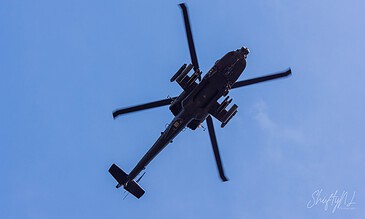 Underside of an AH-64D Apache of 301 Squadron "Redskins", Royal Netherlands Air Force banking against a clear blue sky at the Bergen (Osterheide) shooting range, Germany, March 2017.