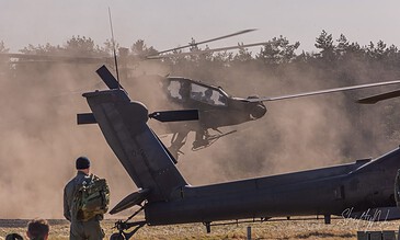 AH-64D Apache of 301 Squadron "Redskins", Royal Netherlands Air Force, landing in a thick cloud of sand and dust at the Bergen (Osterheide) shooting range, Germany, March 2017.