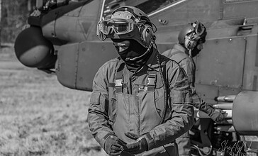Black and white portrait of a 301 Squadron "Redskins" Apache crew member at the Bergen (Osterheide) shooting range, Germany, March 2017.