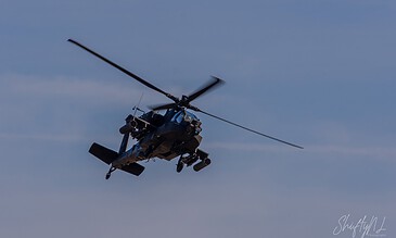 AH-64D Apache of 301 Squadron "Redskins", Royal Netherlands Air Force, in a hard bank against a cloudy sky at the Bergen (Osterheide) shooting range, Germany, March 2017.
