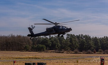 AH-64D Apache of 301 Squadron "Redskins", Royal Netherlands Air Force, flying nap-of-the-earth just above the ground at the Bergen (Osterheide) shooting range, Germany, March 2017.