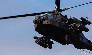 AH-64D Apache of 301 Squadron "Redskins", Royal Netherlands Air Force, passing right overhead, seen from below at the Bergen (Osterheide) shooting range, Germany, March 2017.