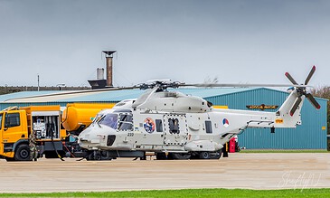 NH90 helicopters on the platform with the control tower behind at Naval Air Station De Kooy, the Netherlands, during a visit to 860 Squadron, October 2017.
