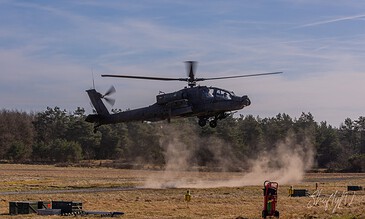 AH-64D Apache of 301 Squadron "Redskins", Royal Netherlands Air Force, making a low pass along the treeline at the Bergen (Osterheide) shooting range, Germany, March 2017.