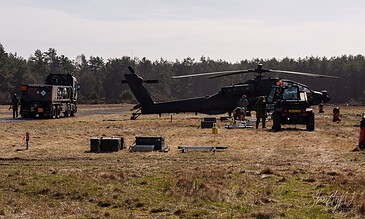 AH-64D Apache of 301 Squadron "Redskins", Royal Netherlands Air Force, parked on the field between sorties at the Bergen (Osterheide) shooting range, Germany, March 2017.