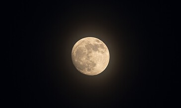Moon with detailed craters illuminating the night sky, captured with high precision and clarity.