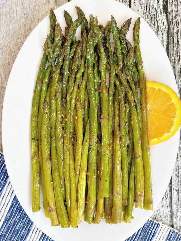 Simple Sauteed Asparagus on a white plate 