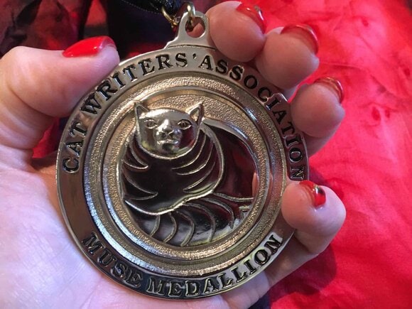 CWA Muse Medallion closeup
