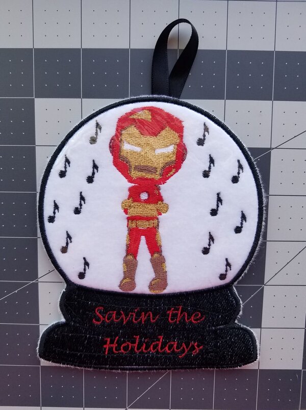 Snow Globe Boy in a superhero costume