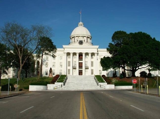 A road leading up to the white Alabama State Capital building