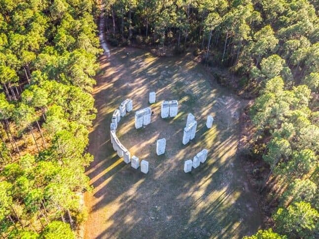 An aerial view of Bamahenge, a replica of Stonehenge, surrounded by trees