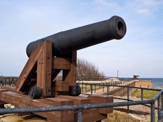 A large canon on a hill overlooking the coast in Alabama