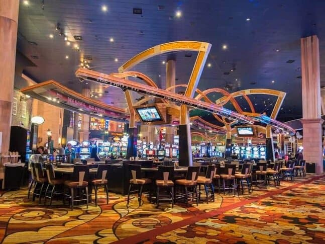 Some slot machines and people gambling inside a Las Vegas casino