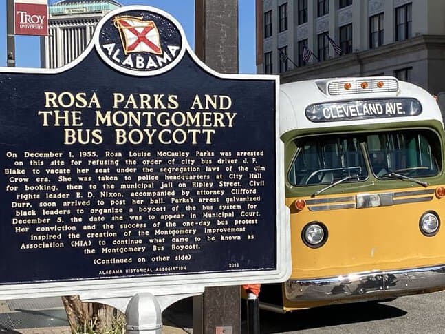 A museum display introducing Rosa Parks and a model of the bus on which she refused to move seats