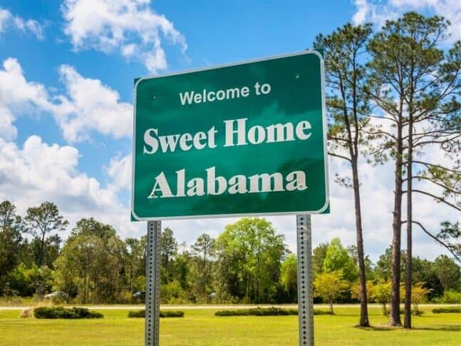A road sign that says "Welcome to Sweet Home Alabama"