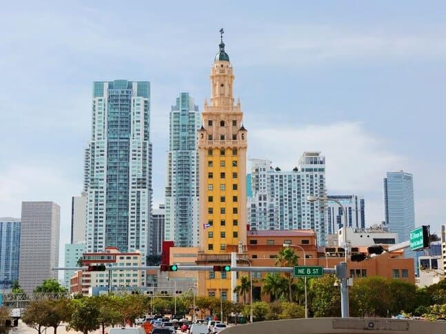 View of the Freedom Tower in Miami, Florida, with other skyscrapers behind it