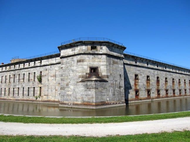 A stone fort called Fort Delaware with a moat of water around it