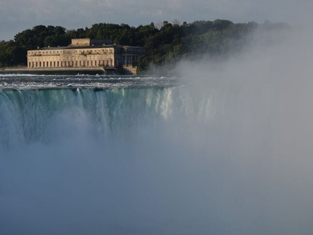 A hydroelectric plant in the top left corner above Niagara Falls