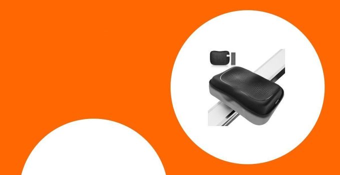 Black massage cushion on an orange and white background, shown in two views: a main close-up and a smaller angled view.