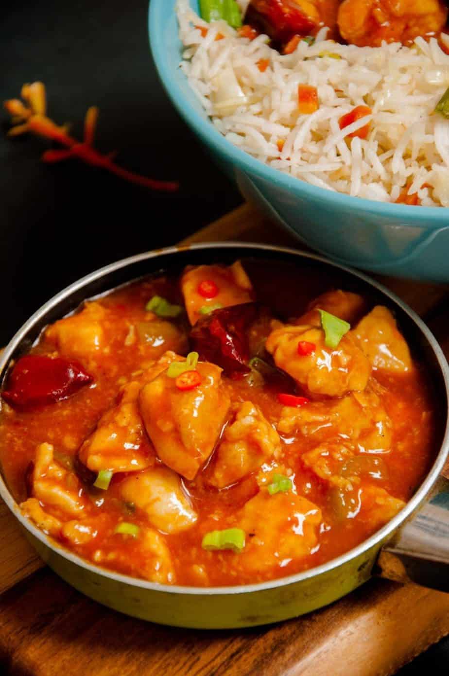 Chicken Manchurian served in a tiny single serving fry pan.