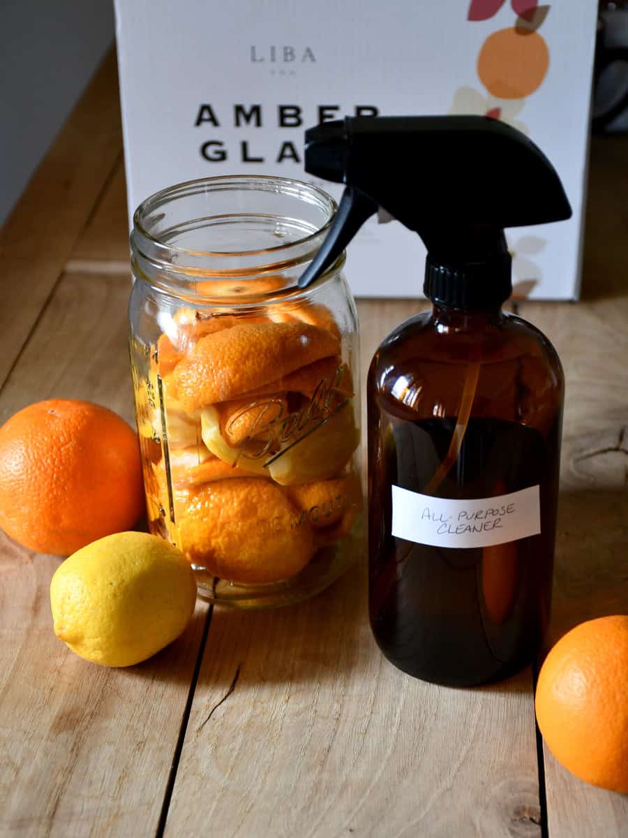 It is the same scene as above only a white label has been attached to the amber bottle reading, "all-purpose cleaner".