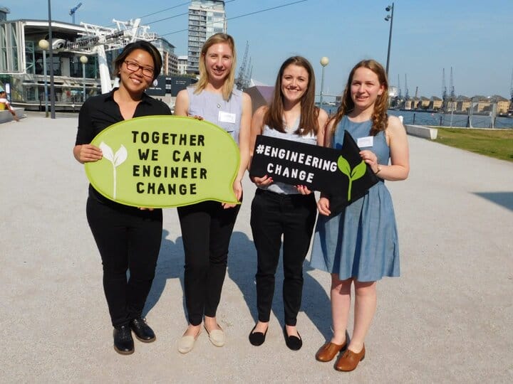 Four women standing with speech bubbles