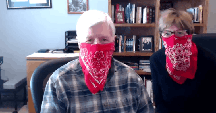 Ken and Libby Guthrie wearing cowboy bandanas over their faces