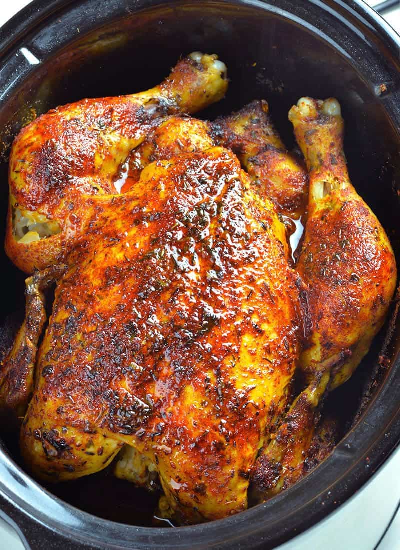 Whole chicken cooked in a slow cooker.