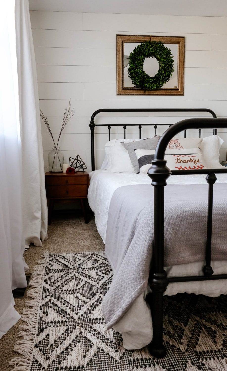 natural light from a window pouring in to brighten a bedroom 