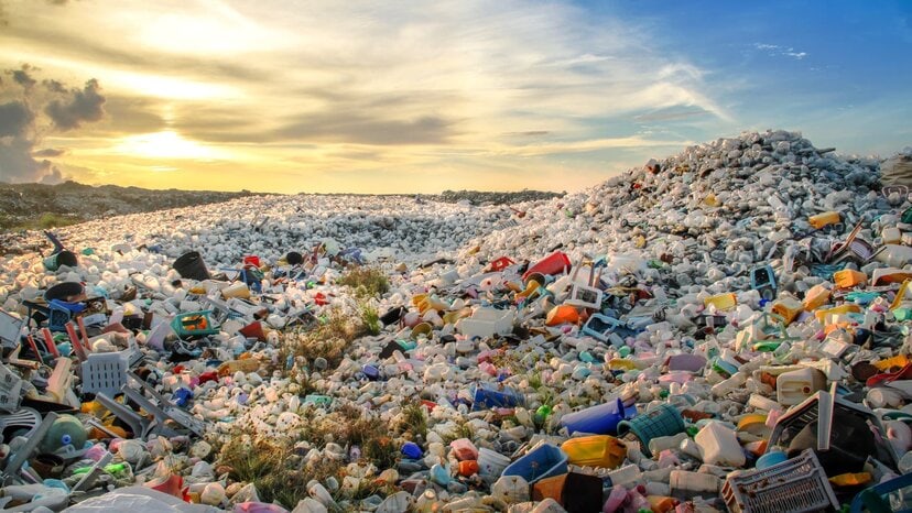 a landfill filled with plastic bottles and other waste