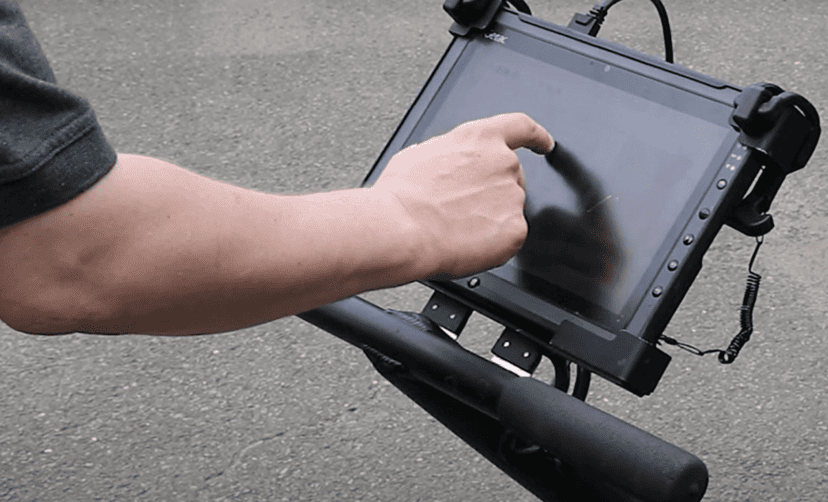 A field worker uses a tablet to set up a GPR survey