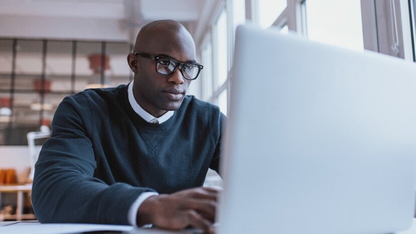 a person types on a computer