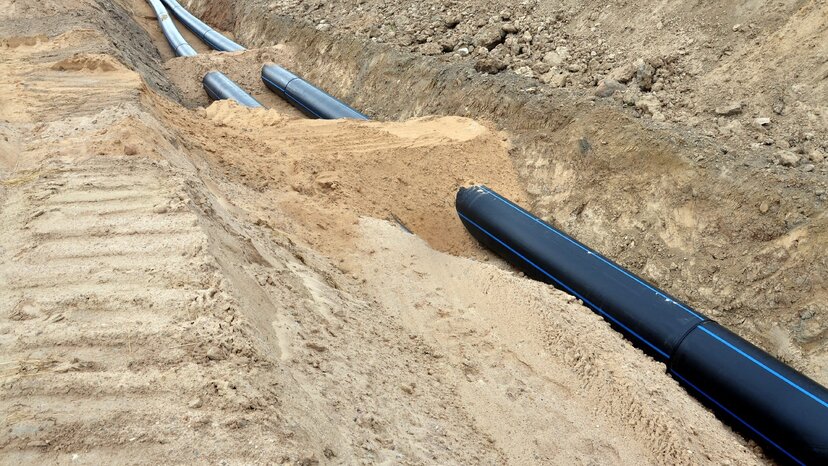 pipes are buried under some sand