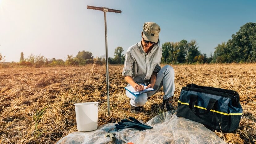 a researcher takes notes in the field