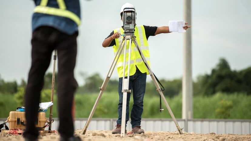 a construction worker surveys a site