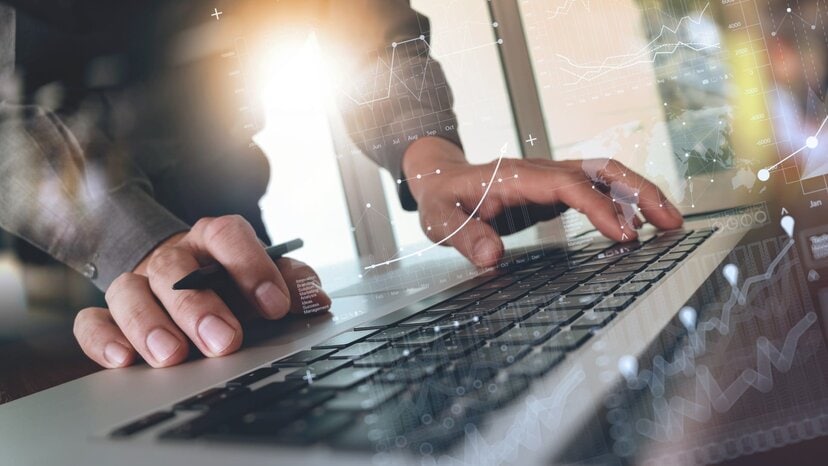 person types on computer