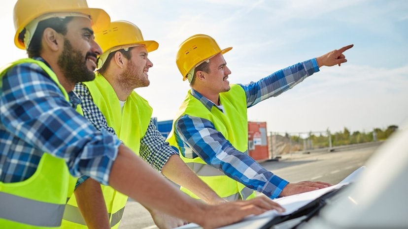 construction workers survey the land after learning how to locate buried objects with GPR