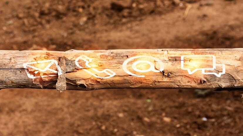 contact us icons display on a tree trunk