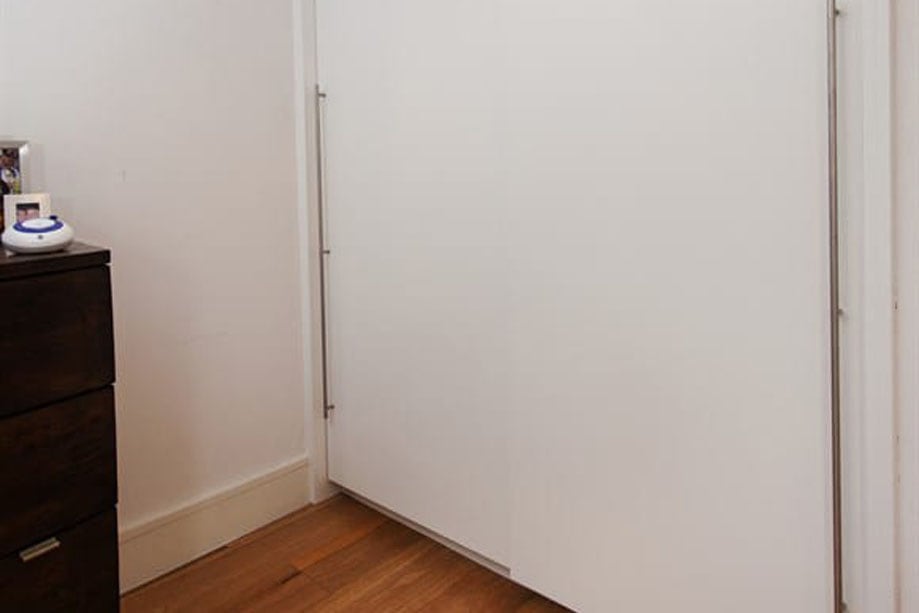 Full view of a custom made wardrobe designed for a resident of Putney London United Kingdom