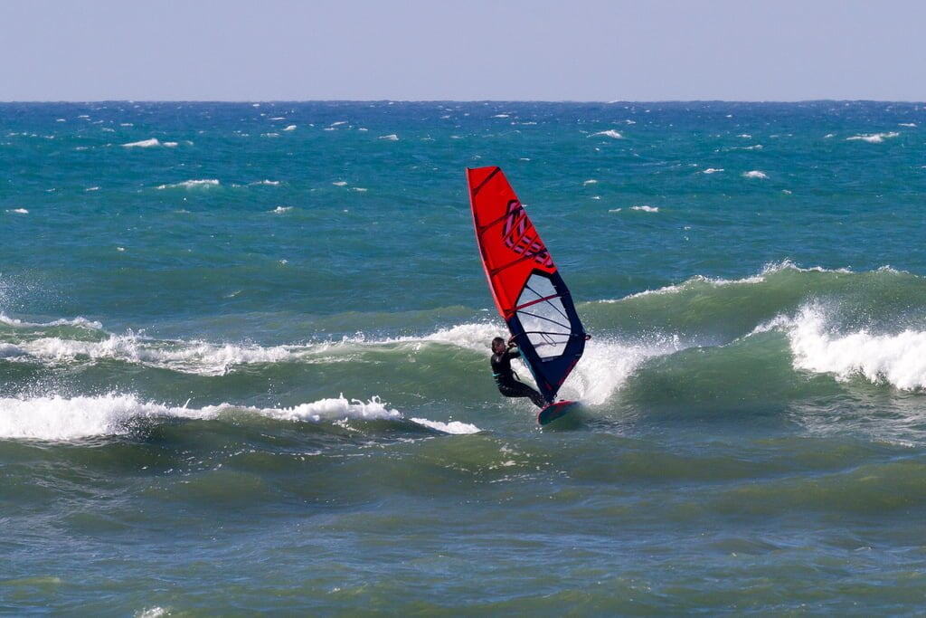 Windsurfer on a wave in Taranaki, New Zealand