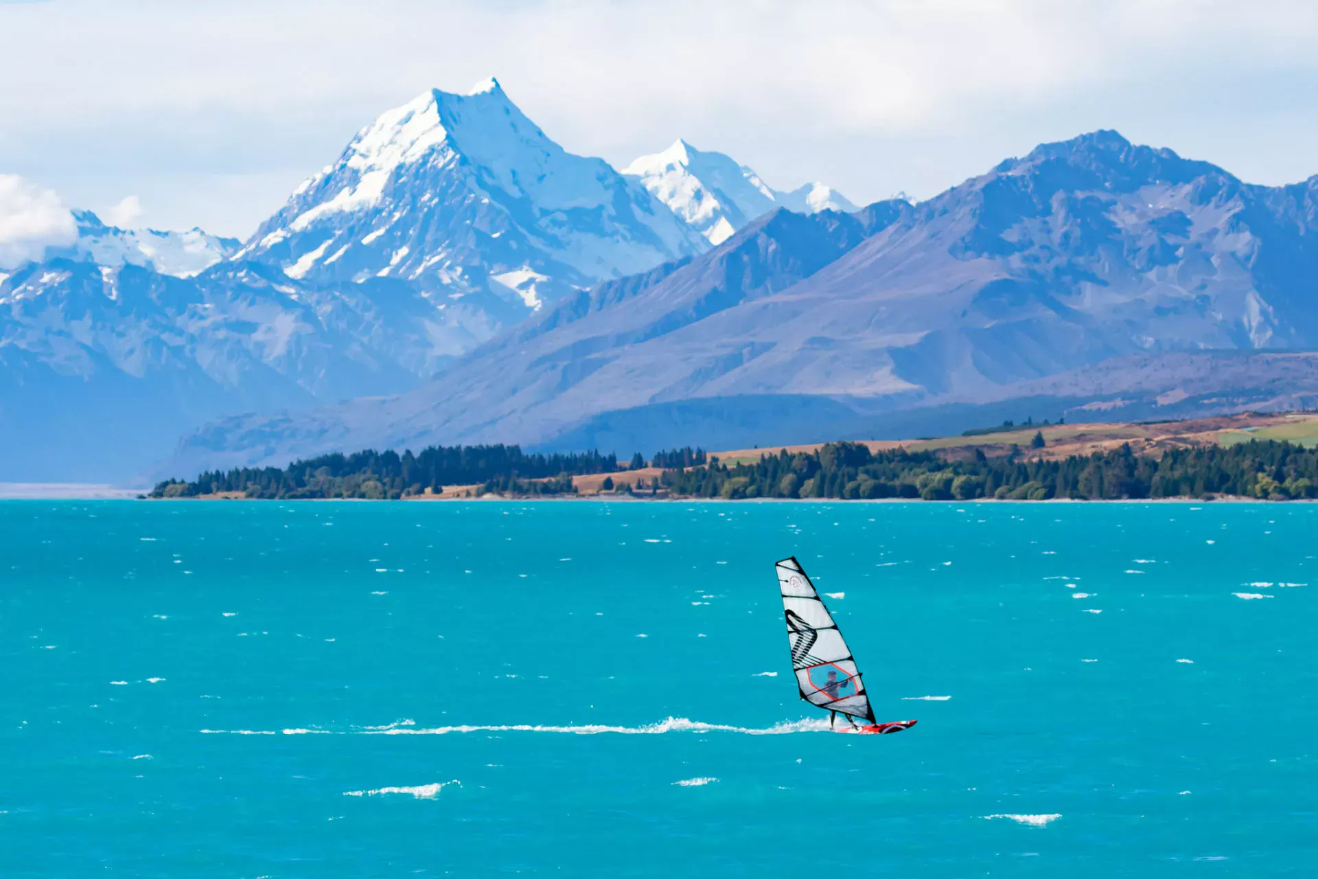 Windsurfer on Lake Pukaki with Mount Cook in the background