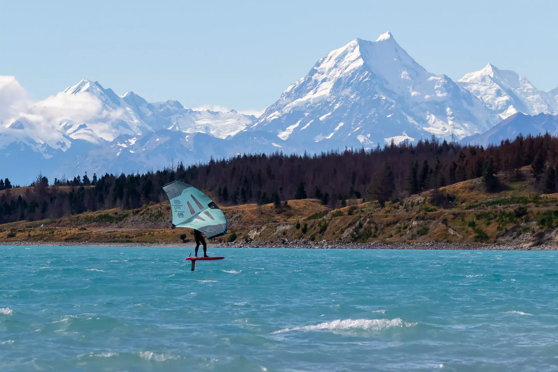 Wingfoiler on Lake Pukaki with Mount Cook in the background